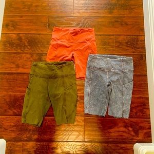 Three pairs of Lulu right above the knee shorts